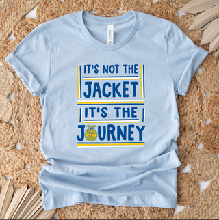 Light blue t-shirt with motivational quote on a woven mat