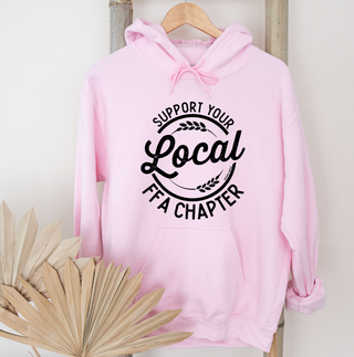 Pink hoodie with 'Support Your Local Chapter' text on a wooden hanger against a white background.