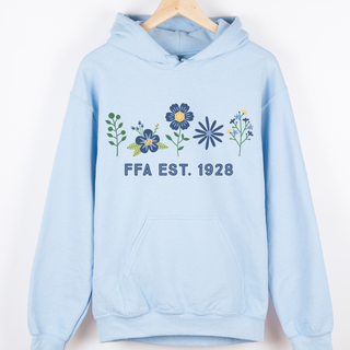 Light blue hoodie with floral designs and 'FFA EST. 1928' text on a white background