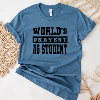 WORLDS OKAYEST Ag Student – Bella Canvas T-Shirt